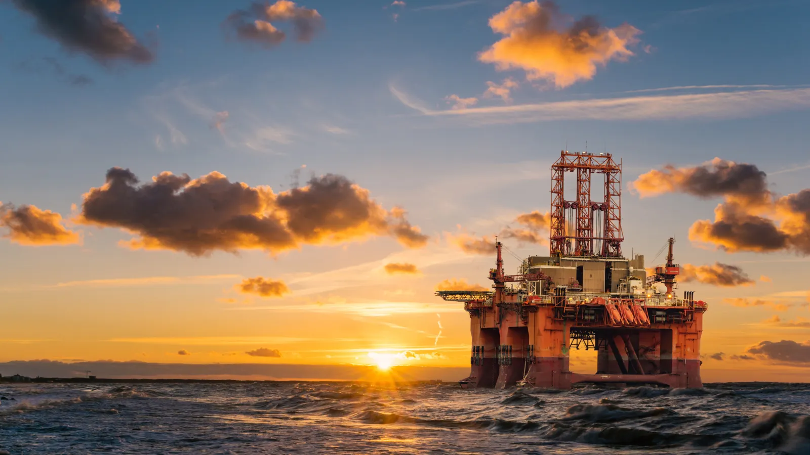 Offshore drilling platform at sunset